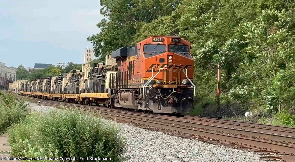 BNSF 4267 helps lift a fairly long train and all loads.